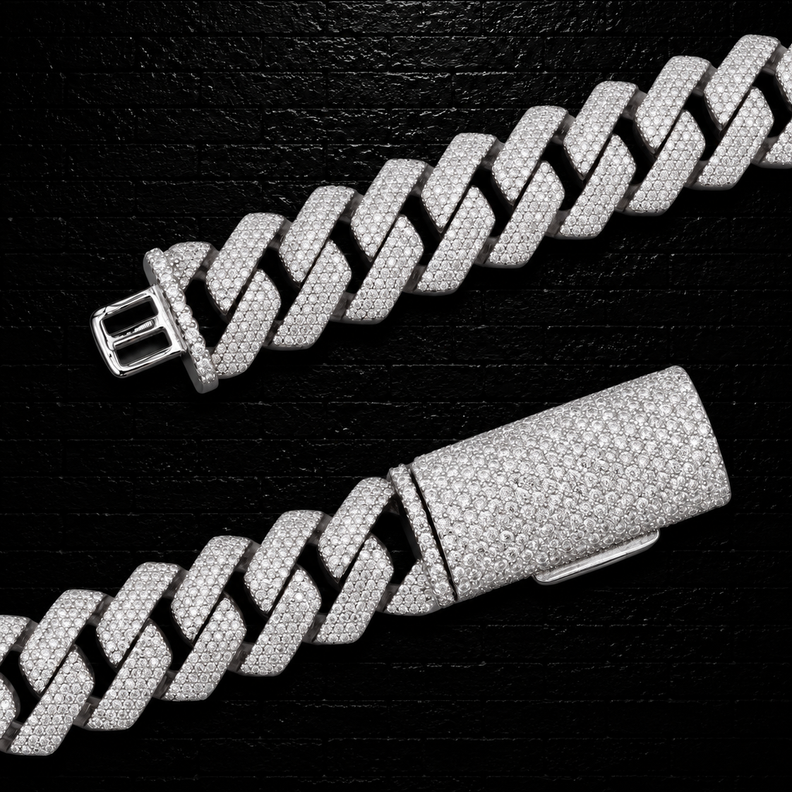 Silver chain bracelet on a black textured background
